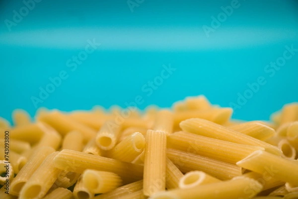 Obraz Pasta isolated on blue background with copy space