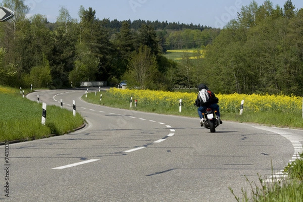 Fototapeta On the road. Motorcycle on the rural road. 