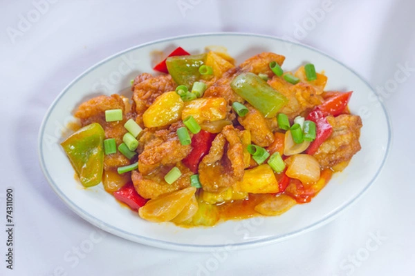 Fototapeta Sweet and sour sauce fried with pork