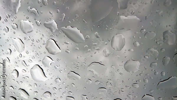 Obraz Raindrops texture on window with dark clouds in the background.