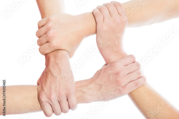 Fototapeta Solidarity concept using joined hands.