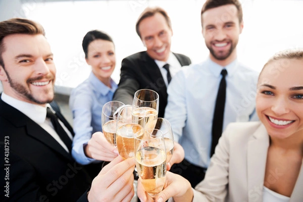 Fototapeta Toasting to success.