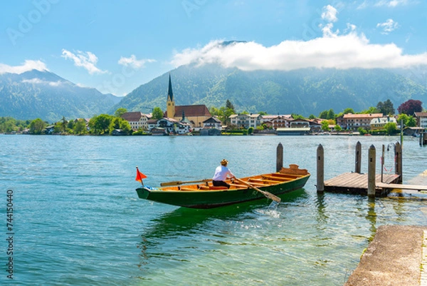 Obraz A summer day on Lake Tegernsee, Bavaria. Wooden boat at the pier