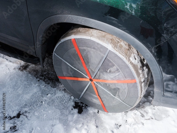 Obraz snow socks chaine on winter road