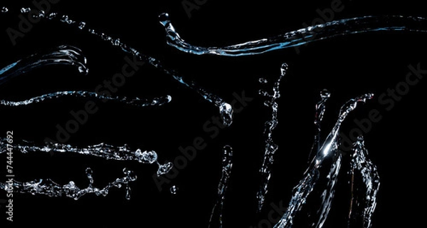 Obraz Various water jets isolated on a black background.
