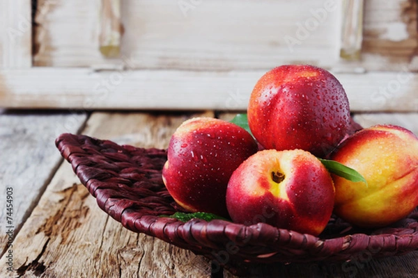 Obraz nectarine in a wicker plate