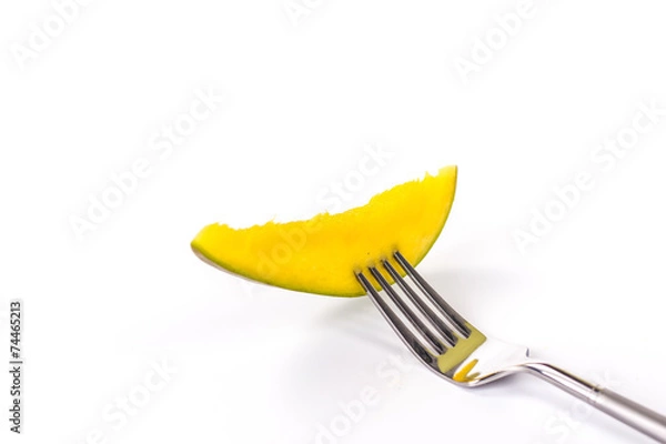 Fototapeta sliced mango on fork isolated