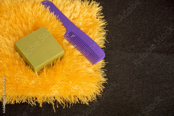 Fototapeta hand-knitted bath loofah in yellow color and pattern,