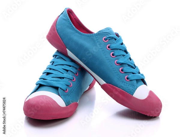 Obraz Pair of blue sneakers on a white background