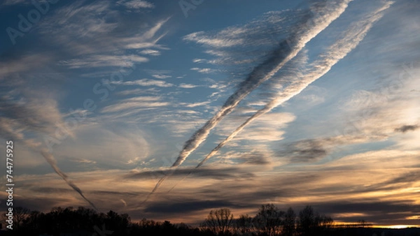 Obraz Contrails Reaching Across the Sunset Sky