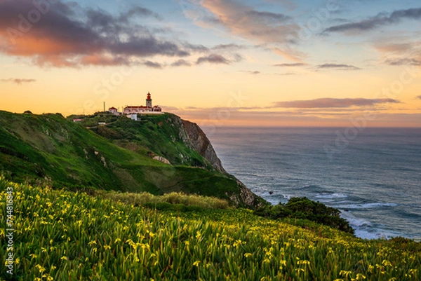 Fototapeta View of the Cabo da Roca lighthouse. Sintra, Portugal. Cape Cabo da Roca, the westernmost point of Europe. Beautiful sunrise at the coast near Lisbon. 
