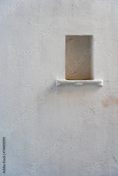Fototapeta White wall background with a niche in city Udaipur, Rajasthan, India. Closeup, copy space