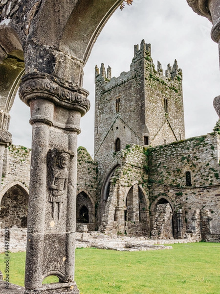 Obraz Jerpoint Abbey tipperary Ireland ancient cloister sculptures unique depicting saints and ornamentation, irregular, worn, and decayed, but restored 