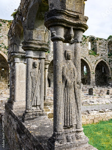 Obraz Jerpoint Abbey tipperary Ireland ancient cloister sculptures unique depicting saints and ornamentation, irregular, worn, and decayed, but restored 