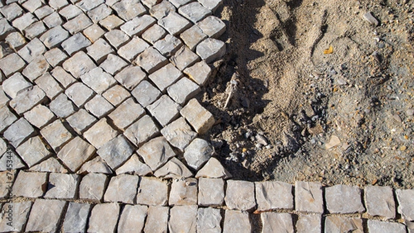 Obraz Pose de pavés en pierre.