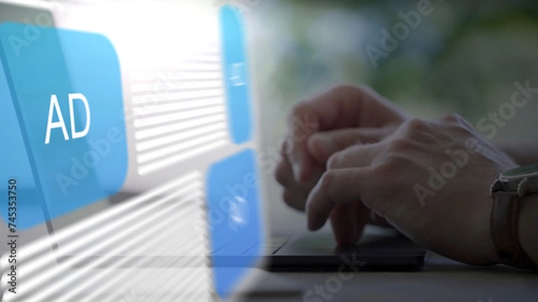 Fototapeta person working on a laptop computer with a fictional website with Ads hovering as a hologram over the keyboard, advertising, marketing, online, digital, business, augmented reality, remote work