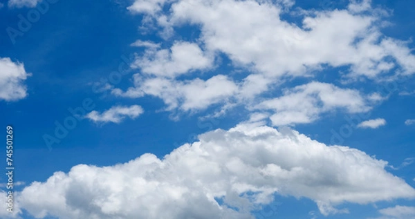 Fototapeta Panorama blue sky clouds pattern on daylight with copy space. Cumulus cloudscape air climate sunny day. Blue sky fluffy white clouds on summer season bright clear skyline with beautiful cloudscape