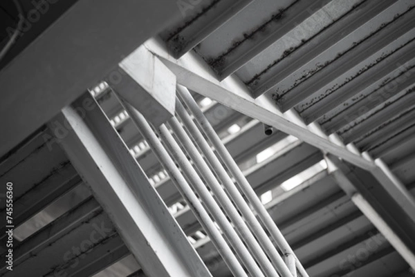 Fototapeta Metal overpass platform with banister structure of the factory place. Industrial building part. Close-up and selective focus.