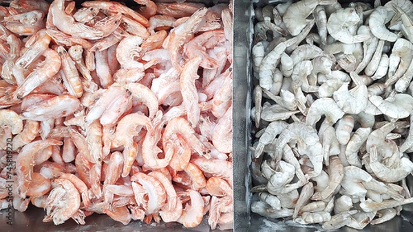Fototapeta Species of frozen shrimps close up in a freezer