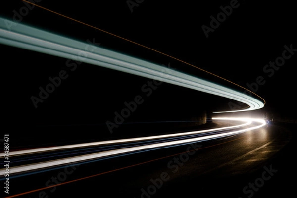 Obraz Abstract blue, yellow and white rays of light in a car tunnel