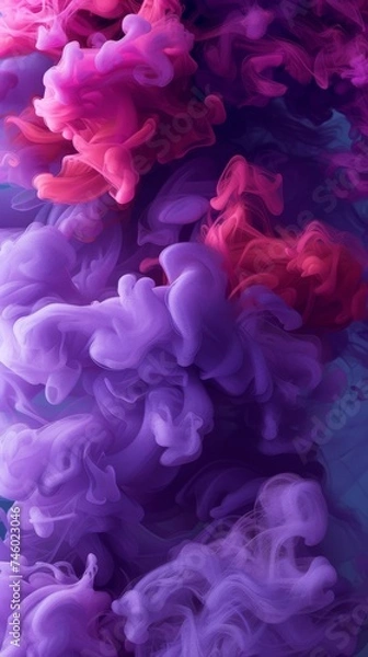 Obraz Close up view of vibrant colored ink dispersing and intermingling in water, creating beautiful abstract patterns and swirls