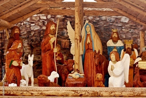 Obraz Wooden nativity scene, outdoor Christmas decoration. Hand-carved sculptures in the exterior.