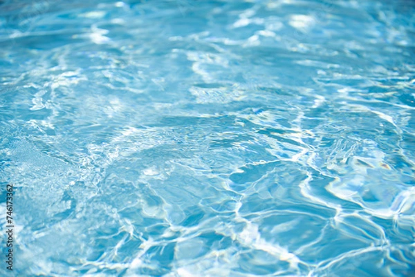 Fototapeta Ripped water in swimming pool. Surface of blue swimming pool, background of water.