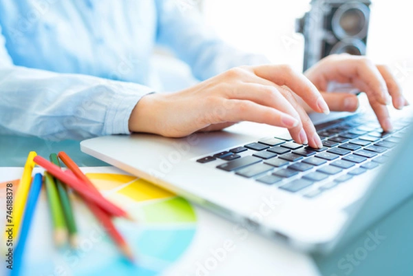 Obraz Woman office worker typing on the keyboard