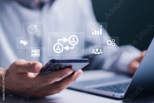 Obraz B2B marketing concept. business to business, e-commerce, Professional business and commerce collaboration. business action plan strategy. Businessman showing B2B icon on virtual screen.