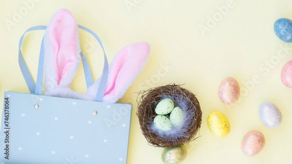 Fototapeta Easter composition with colorful eggs and gift bag