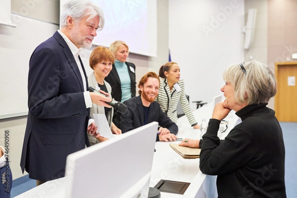 Fototapeta Orator discussing with audience during business conference