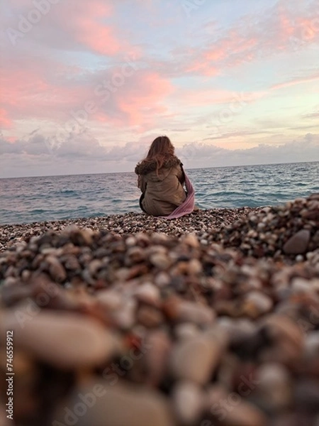 Obraz person sitting on the beach