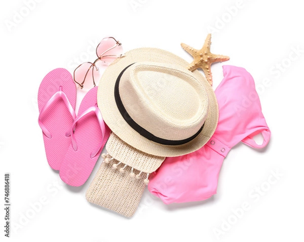 Fototapeta Stylish beach hat, flip flops, bikini bra, sunglasses and starfish on white background