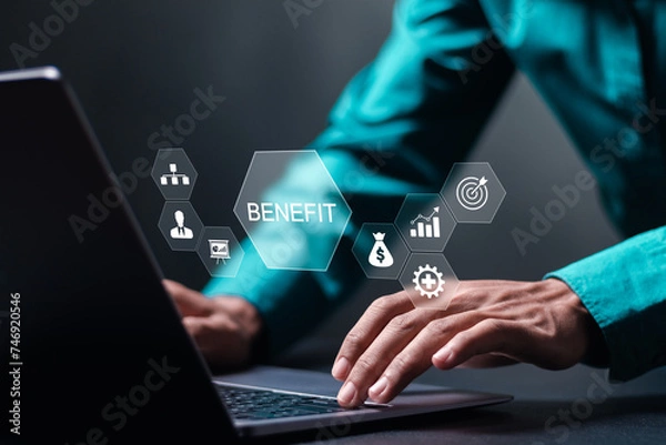 Fototapeta Benefit concept. Employee benefits help to get the best human resources. Businessman use laptop with BENEFIT word on virtual screen