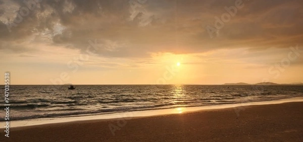 Obraz Seaside, view of the evening sky as the sun approaches to set.