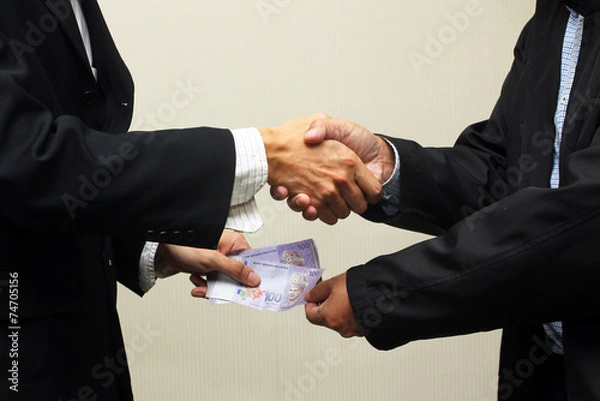 Obraz Malaysian business corruption with ringgit notes