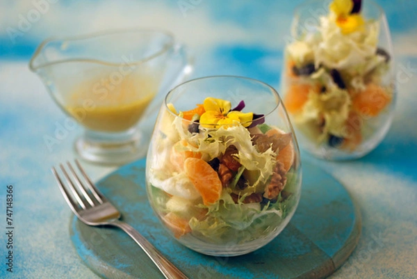 Obraz Escarole salad with tangerines.