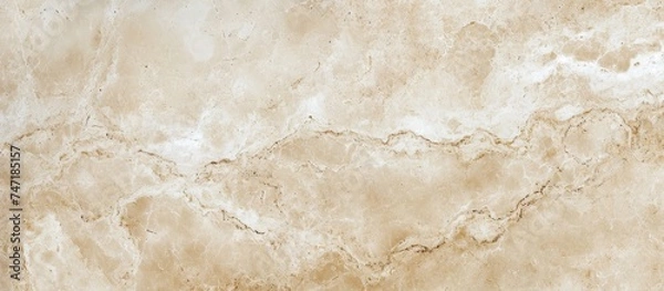 Fototapeta A detailed close up of a brown and beige marble flooring texture, showcasing a beautiful pattern resembling fur or bedrock.