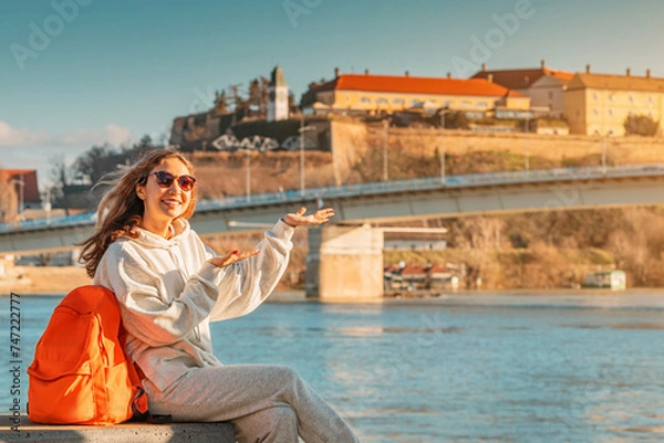 Fototapeta Student or traveller girl exploring Petrovaradin fortress at Novi Sad city in Serbia