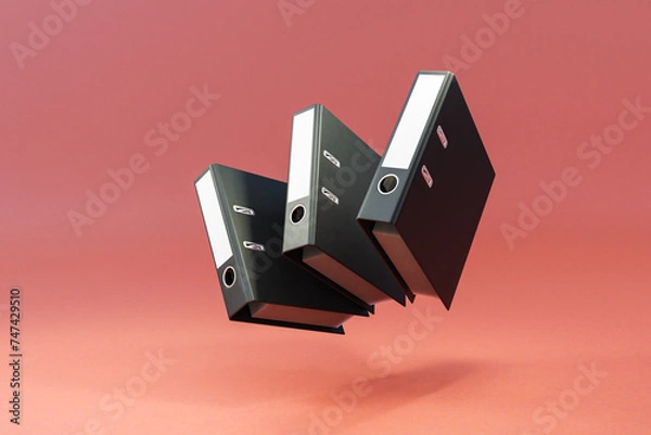 Fototapeta three black folder document binder floating and falling over clean surface; object isolated on infinite background; 3D rednering