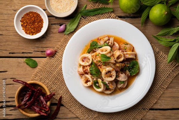 Obraz Squid Spicy Salad with Herbs,Hot and Sour Squid with Chilli, Mint leaf and Coriander in lime sauce (Yam pla muk) .Top view