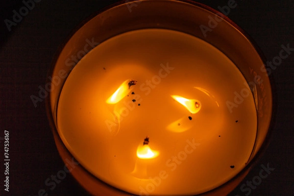Obraz burning candle in the dark