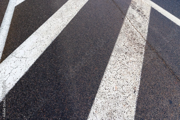 Obraz old road markings on the highway in winter