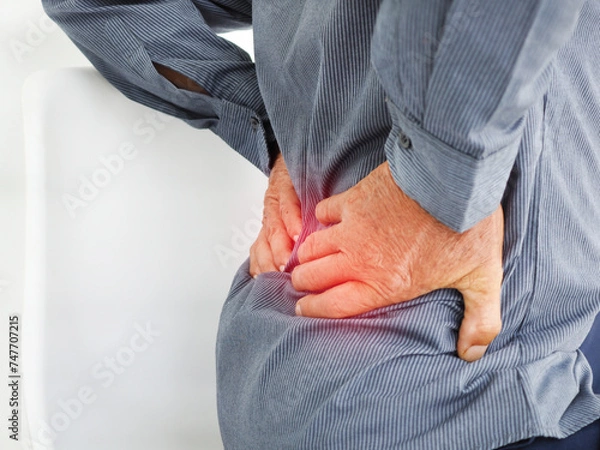 Obraz Old man suffering of backache, touching back with hand. Health care concept.