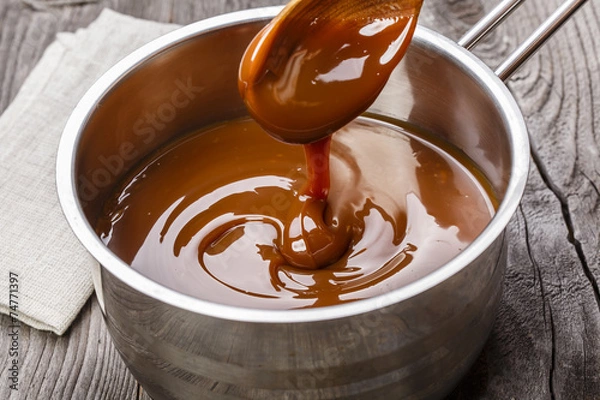 Fototapeta liquid caramel is poured