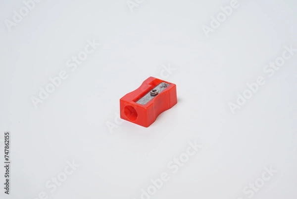 Obraz A red pencil sharpener top angle on a white background