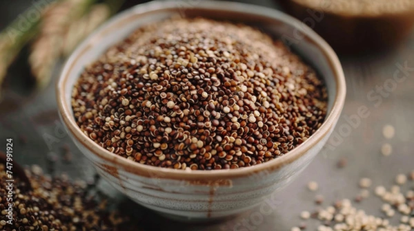 Fototapeta A bowl of quinoa a glutenfree grain that is widely used in vegan and vegetarian dishes for its high protein content and nutty taste.
