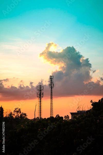 Fototapeta sunset sky with silhouette antenna