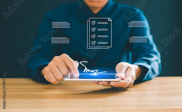 Fototapeta electronic signature Electronic signatures, office document management Businessman signing documents on virtual screen
