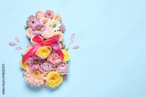 Obraz 8 March greeting card design made with beautiful flowers on light blue background, top view. Space for text